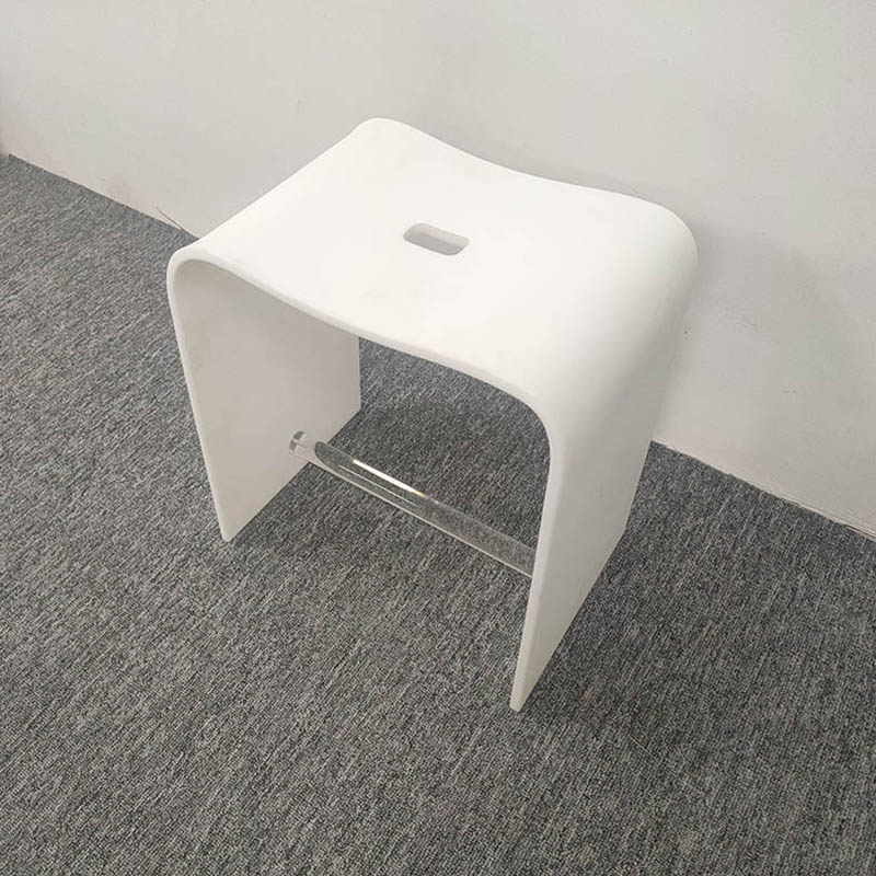 The white acrylic stool is used for bathing in hotels