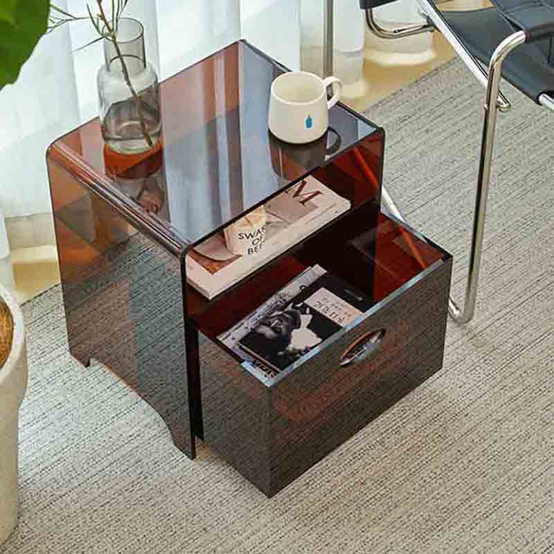 The acrylic bedside table has drawers and wheels