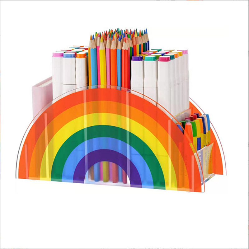 An acrylic pen holder with a rainbow pattern